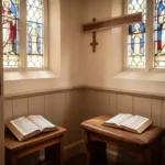 Open prayer book beside a quiet Catholic confessional