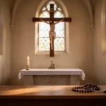 Wooden crucifix and rosary in a quiet church during prayer