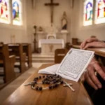 Spanish prayer booklet and Rosary beads on a church pew