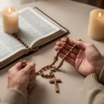 How many mysteries of the Rosary are there? Rosary beads, Bible, and candle arranged for quiet prayer