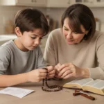 Parent teaching child to pray with a simple rosary at home