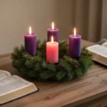 Catholic family Advent wreath with violet and rose candles glowing