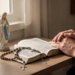 Litany of the Immaculate Heart of Mary: Meaning and Prayer Prayer corner with rosary and Marian statue beside an open prayer book