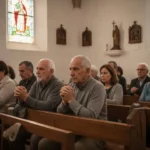 People praying quietly together inside a Spanish-speaking church