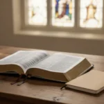 Open Bible and notebook representing reflection on Romans 1:16-17