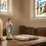 Candle and saint statue representing prayer for anxiety support